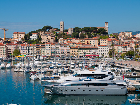 Cannes France - April, 25 2010: Cannes Waterfront with luxury powerboats in the foreground