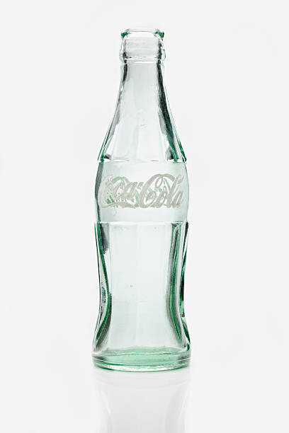 Bucharest, Romania - November 29, 2011: Five vintage Coca-Cola bottle caps, 125 years old anniversary edition, studio shot.