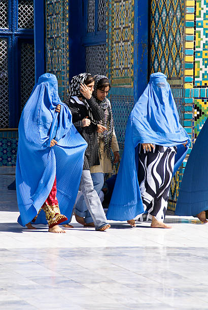 4 Afghan Women at the Blue Mosque in Mazar-e-Sharif, Afghanistan stock photo