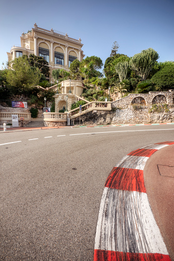 Monte Carlo, Monaco - October 4, 2009: The Grand Casino in Monte Carlo seen behind the famous hairpin turn of Virage Rascasse leading on to the uphill section of the Monaco Grand Prix route. Monaco has hosted the prestigious Formula One Monaco Grand Prix every year since 1929, with exception of 1938 - 1947.