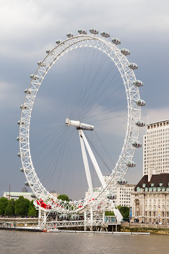 London, United Kingdom - Feb 21, 2018: London Eye in afternoon sun. The giant Ferris wheel is 135 meters tall and the wheel has a diameter of 120 meters.