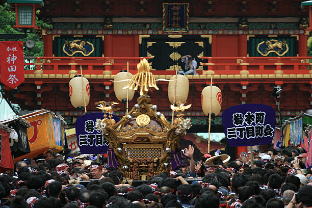 Tokyo, Tokyo / Japan – May 15, 2010: Sanja Matsuri Festival – Tokyo’s biggest Shinto religious festival celebrated every year on the third weekend of May with mikoshi portable shrines carried on people’s arms at the parade through the streets of Asakusa district in Tokyo. Considered wildest and largest festival in Japan.