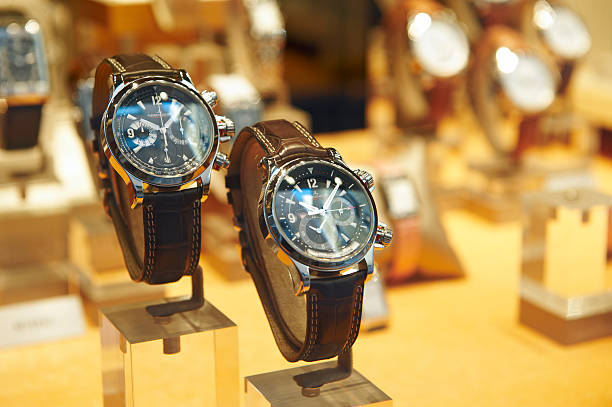 Three wrist watches in row. The first in foreground is a cronograph classic watch, the one in the middle is a pilot style and the last one in the background is a submarine watch.