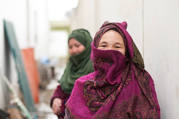 Erbil, Kurdistan, Iraq - October 05, 2015: Five eldrely women in IDP camp in front of their container and talking together. In this camp are living christans who run away from IS.