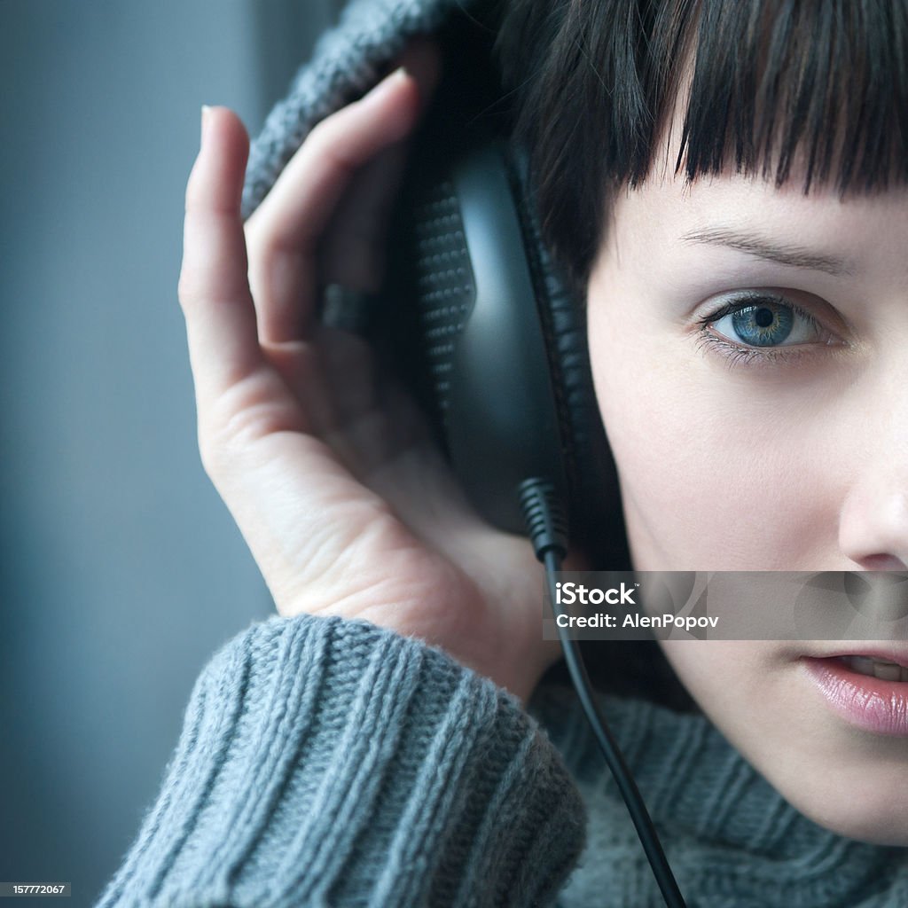 Enjoying music Young woman enjoying music. Headphones Stock Photo