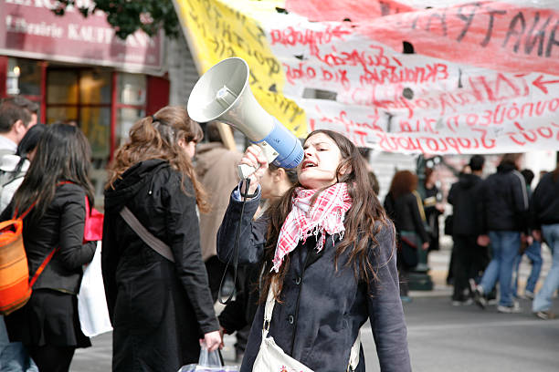 Young protestor with megaphone stock photo