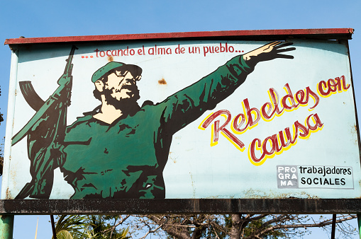 Rafael Freyre, Cuba-March 03, 2010

Poster in a small Cuban village in Holguín Province of Cuba showing Castro in army fatiques brandishing a rifle with  revolutionary text written in Spanish. ... touching the soul of a village... Rebels with a cause - social workers