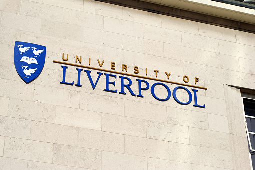 Liverpool, England - February 26, 2011: The University of Liverpool logo on a university building. The University of Liverpool is a teaching and research university in the city of Liverpool, England. It is a member of the Russell Group of large research-intensive universities and the N8 Group for research collaboration.
