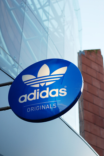 Liverpool, England - February 27, 2011: Sign of the Adidas store in Liverpool. Adidas AG is a German sports apparel manufacturer and parent company of the Adidas Group.