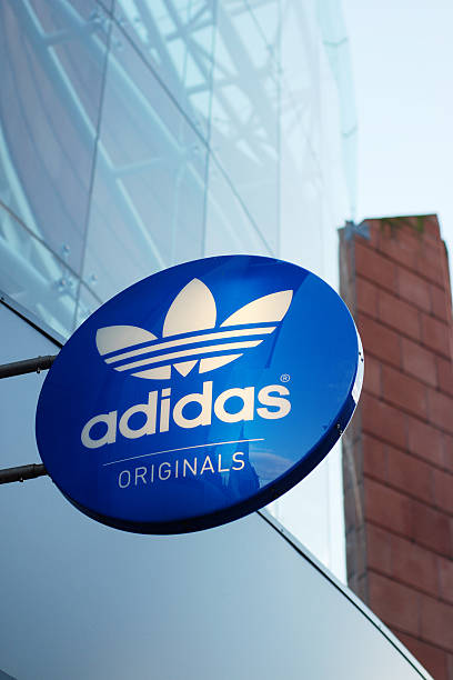 Sign of the Adidas store in Liverpool Liverpool, England - February 27, 2011: Sign of the Adidas store in Liverpool. Adidas AG is a German sports apparel manufacturer and parent company of the Adidas Group. liverpool one stock pictures, royalty-free photos & images