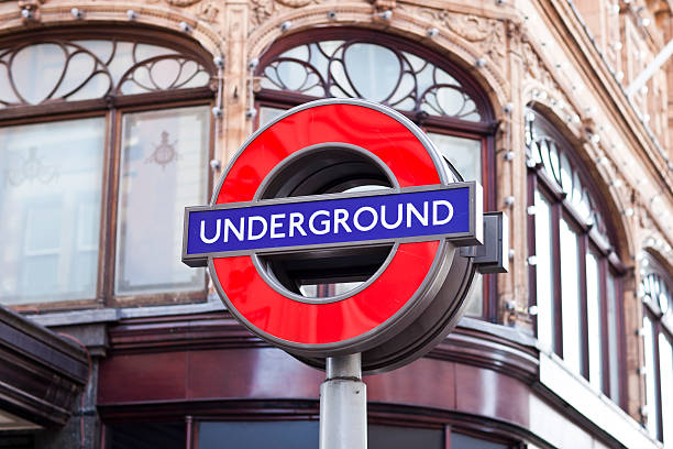 London Underground famous sign in front of Harrods department store  harrods photos stock pictures, royalty-free photos & images
