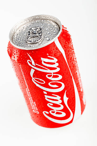 Glass of soft drink with reflection on white background.