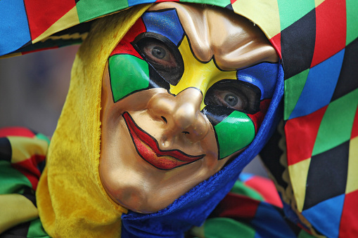 Salvador, Bahia, Brazil - February 11, 2023: People in venice carnival costumes are seen performing during the pre-carnival Fuzue parade in the city of Salvador, Bahia.