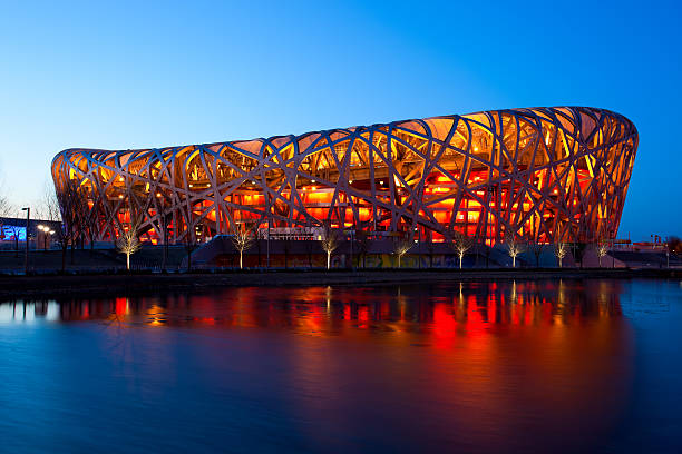 Beijing National Stadium by night  - The Bird's Nest Beijing, China - March 6, 2011: Located on Beijing Olympic Green, the Beijing National Stadium or the Bird's Nest was home of the 2008 Beijing Olympics. beijing olympic stadium photos stock pictures, royalty-free photos & images
