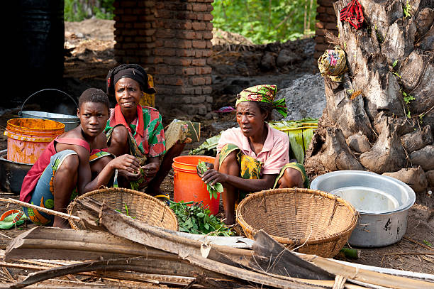 Threee women are working in a palm oil production, Burundi  burundi east africa stock pictures, royalty-free photos & images
