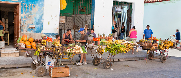 Camaguey, Cuba - January, 23 2007: Colorful street market of fruits and vegetables in the historic centre of the Camaguey, one of the most beautiful cities of Cuba. The city is a UNESCO World Heritage Site since 1988. 