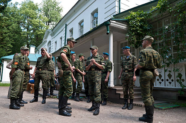 Saint Petersburg-Russia - 16.06.2022: A soldier of the Russian army near the mirror with the inscription Refuel.