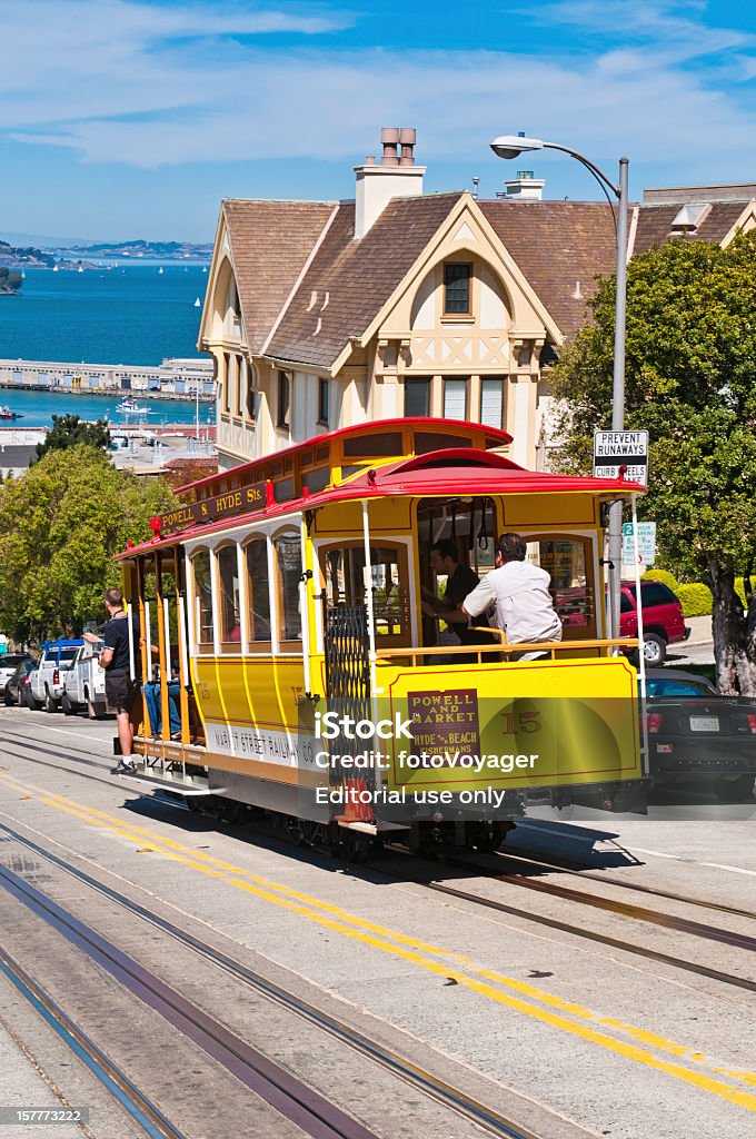 San Francisco iconic cable car riding hill California  American Culture Stock Photo