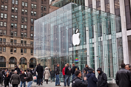 New York, NY, USA - July 9, 2022: Front view of the Apple flagship store on the Fifth Avenue in NYC. Apple, Inc. is an American multinational technology company headquartered in Cupertino, California.