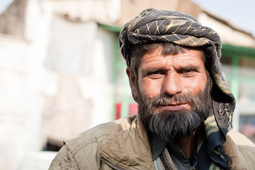 Kabul, Afghanistan - November 16, 2008: Portrait of an Afghan Man who makes a living by begging in the traffic of Shar-e-Naw