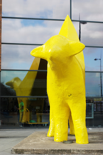 Liverpool, England - March 19, 2011: The Superlambanana is a yellow sculpture intended to be a cross between a banana and a lamb and was created by the Japanese artist Taro Chiezo. It currently stands in Tithebarn Street, outside the Liverpool John Moores University Avril Robarts Library/Learning Resource Centre.