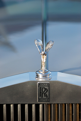 Liverpool, England - January 18, 2009: The Spirit of Ecstasy hood ornament on a Rolls Royce wedding car Model 25/30 parked in the street of Liverpool, The Spirit of Ecstasy was designed by Charles Robinson Sykes.