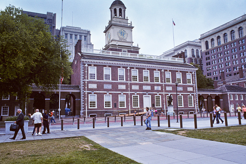 Philadelphia, Pennsylvania, USA - July 27, 2004: People are strolling by historic Independence Hall on a cloudy summer day.