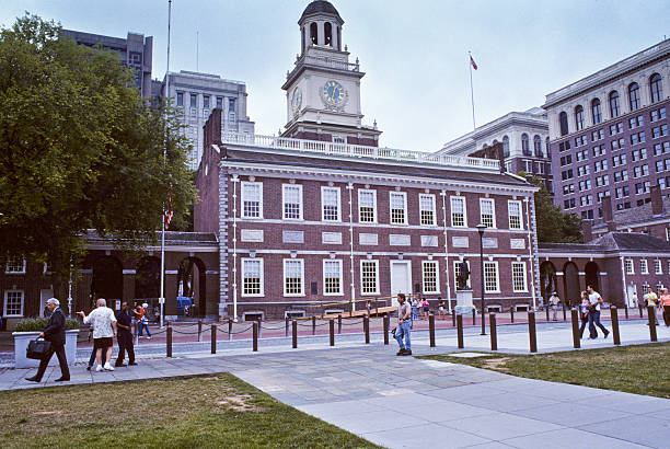 Historic Independence Hall on a Cloudy Summer Day Philadelphia, Pennsylvania, USA - July 27, 2004: People are strolling by historic Independence Hall on a cloudy summer day. jeff goulden government building stock pictures, royalty-free photos & images