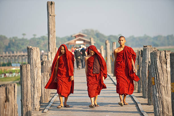 Monks walking on wooden bridge  u bein bridge stock pictures, royalty-free photos & images