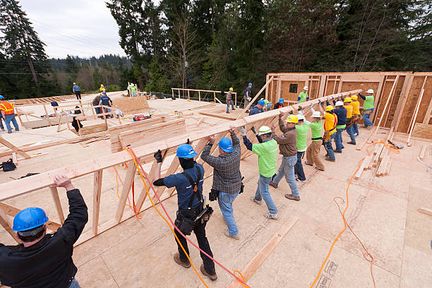 Volunteers build homeless women and children shelter stock photo