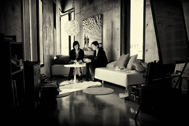 Calgary, Alberta, Canada - April 18, 2011: Meeting between two employees at iStockphoto headquarters in Calgary. This meeting place is located in The Arrow, on the 3rd floor of the building, which is the base of the Content Team. 