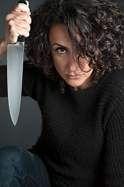 istock woman with a knife 157774655