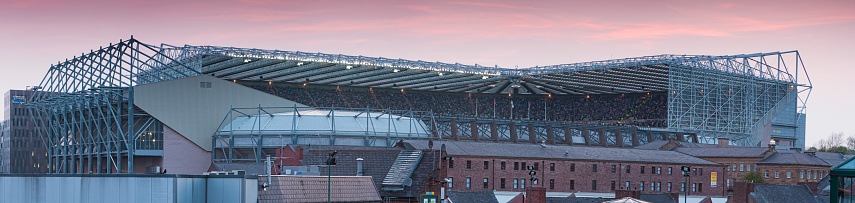 Newcastle upon Tyne, United Kingdom - April 19, 2011 : A panorama of St. James\' Park Stadium as Newcastle United play Manchester United. The away fans are to the right side of the view, ringed by the yellow coats of the police. The final score was 0-0. The image was shot from the Eldon Square multi storey car park roof (council owned).