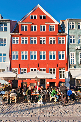 Cozy summer cafe restaurant on the street of the city of Copenhagen, Denmark - July 26, 2023