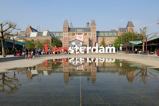 Amsterdam Architecture otuside the Rijksmuseum facades with a blue sky in the background during summer.