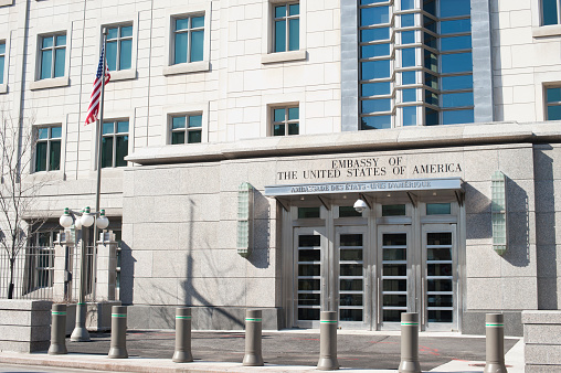 Ottawa, Canada - April 8, 2011: The entrance to the United States of America Embassy in Downtown Ottawa.  The building is a prominent structure on Sussex Drive.