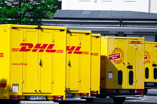 Almaty, Kazakhstan - August 25, 2023: A Volkswagen Transporter car from the DHL company near the office. International delivery