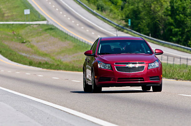 Chevrolet Malibu Changes Lanes On Interstate Highway stock photo