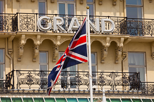 Brighton, England - May 5, 2011: Detailed view of the Grand Hotel, Brighton with the Union Jack Flag in the foreground