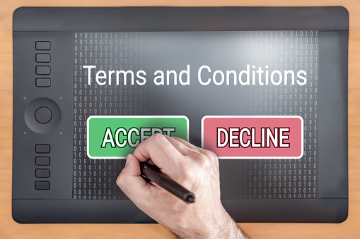 Man accepting terms and conditions on a tablet.