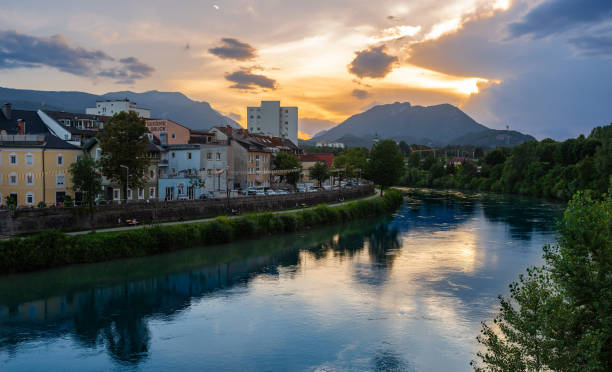 Town of Villach and river Drau in Austria Villach, Austria - July 12, 2023: Cityscape of the austrian town of Villach along the river Drau at sunset villach stock pictures, royalty-free photos & images
