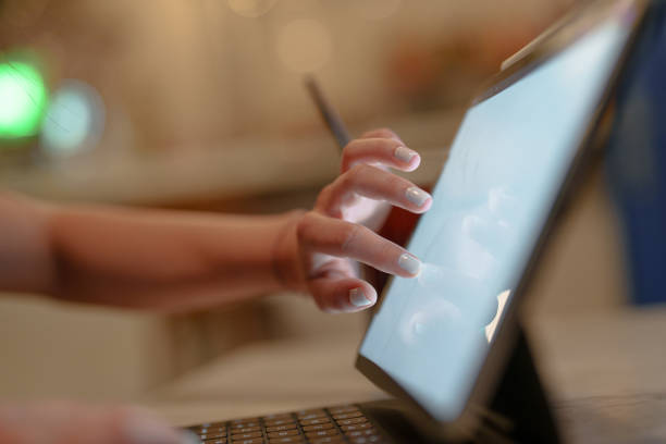 istock Close-up to human hand on digital tablet screen 1577914546