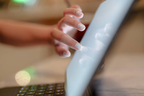 istock Close-up to human hand on digital tablet screen 1577918723