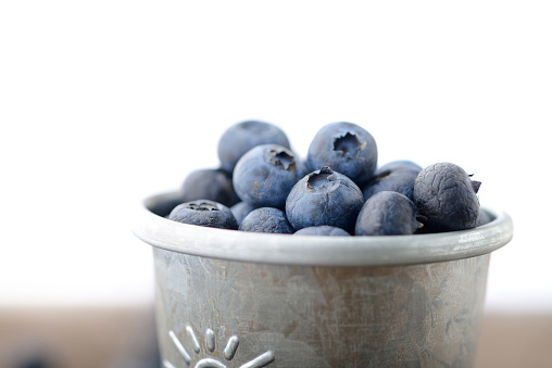 Blueberries on wooden table, macro photo