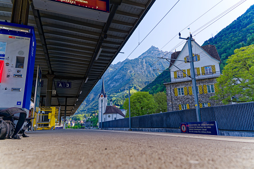 Scenic view of castle Rudenz with yellow and black pattern of wooden shutters with reflections of mountain panorama. Photo taken May 22nd, 2023, Flüelen, Switzerland.