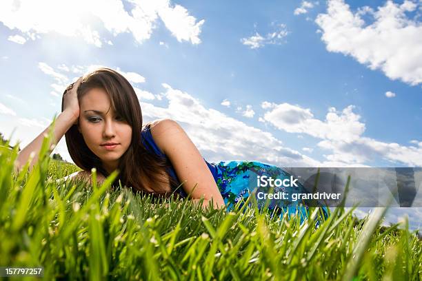Beautiful Girl Lying In Grass Stock Photo - Download Image Now - Adult, Adults Only, Asian and Indian Ethnicities