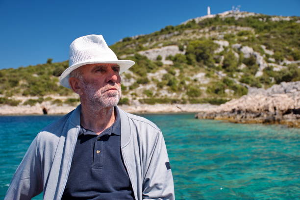 istock Senior man driving boat 1577977150