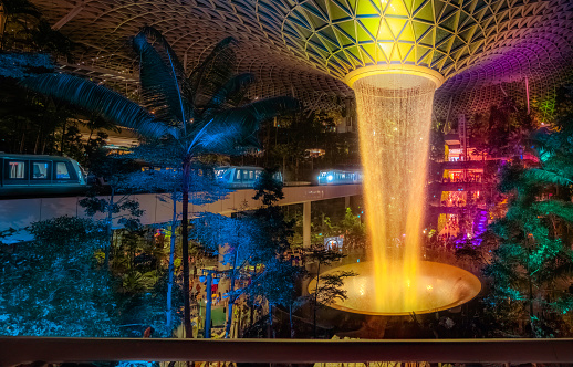 Jewel Changi airport, Singapore - May 28, 2023: Rain Vortex with Colorful Lighting at Jewel Changi Airport