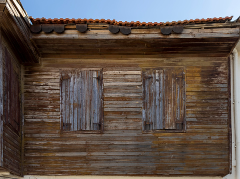 Worn wooden house exterior.