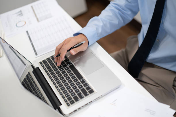istock Business man working by using laptop computer Hands typing on a keyboard. Professional investor working new start up project. business planning in office. Technology business 1578017962
